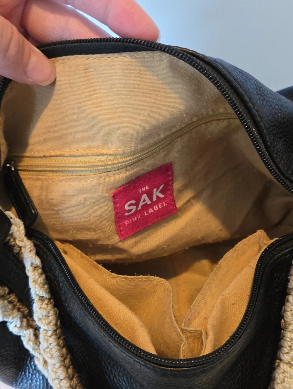 The Sak Pink Label knitted handle black leather handbag.